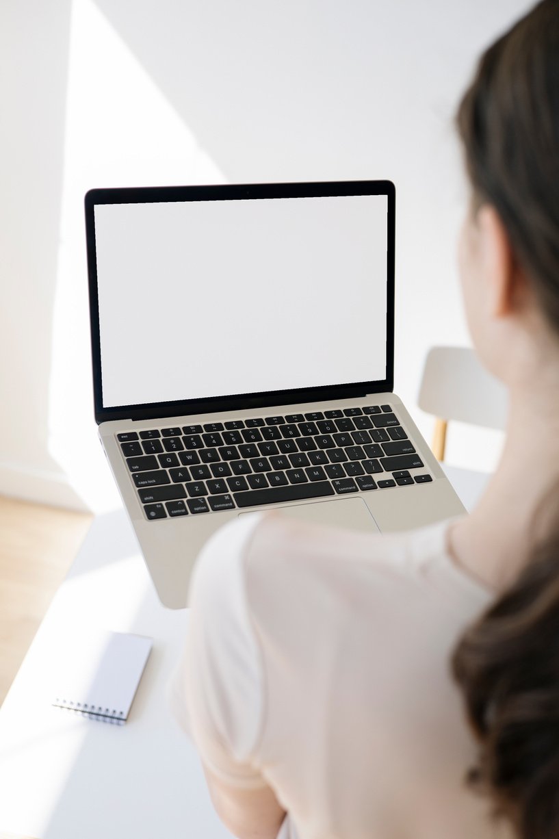 Person in White Shirt and a Laptop